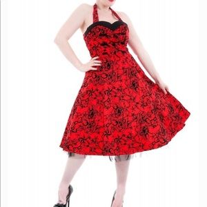 Red HandR dress with black velvet flowers.